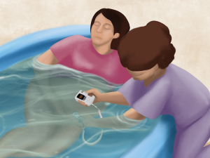 Midwife using an ultrasound device to listen to the baby of a pregnant woman in a birthing pool
