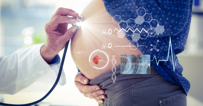 <p>Composition of male doctor touching pregnant woman belly with screen with medical data processing. global medicine and healthcare concept digitally generated image
